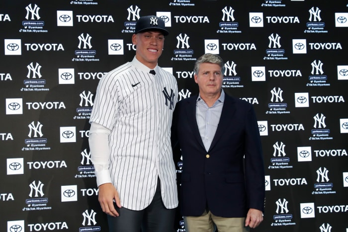 Aaron Judge poses with Yankees owner Hal Steinbrenner during a press conference after being named team captain at Yankee Stadium.